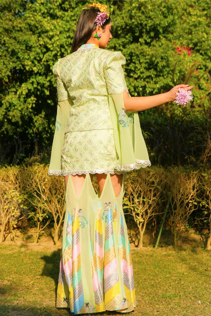 Back pose of Morni Three Piece Set with embroidered blazer, silk skirt, and pastel Bandhani panels.