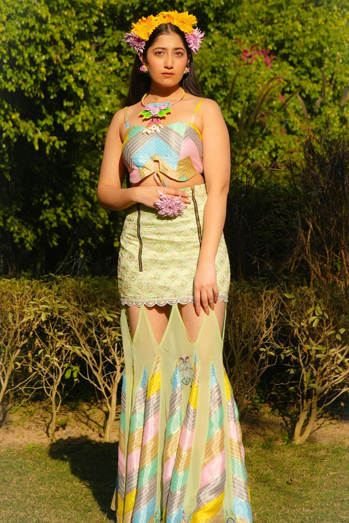 Full view of model wearing Morni Three Piece Set with blazer removed, Bandhani bralette, and silk skirt with flared panels.